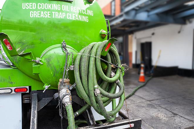 industrial grease trap pumping services in action in Angier